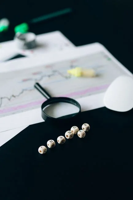 Focused business analysis with charts and graphs on a laptop in a modern office setting.